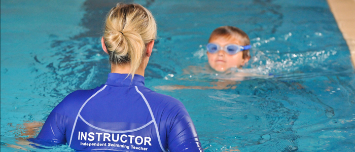 Where should one get enrolled to learn swimming lessons?